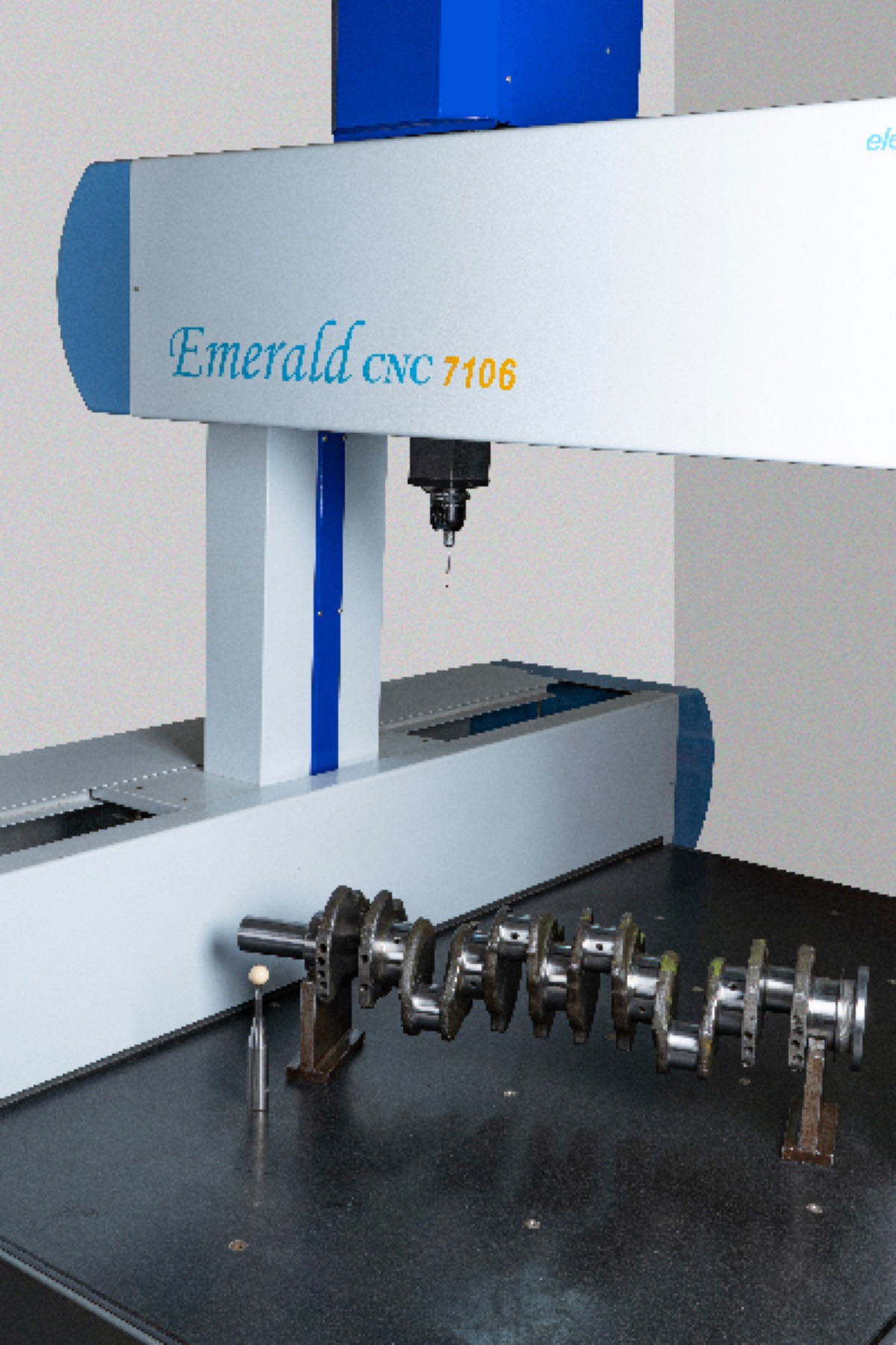 Crankshaft set up on the granite table of an Emerald CNC 7106 coordinate measuring machine for dimensional inspection